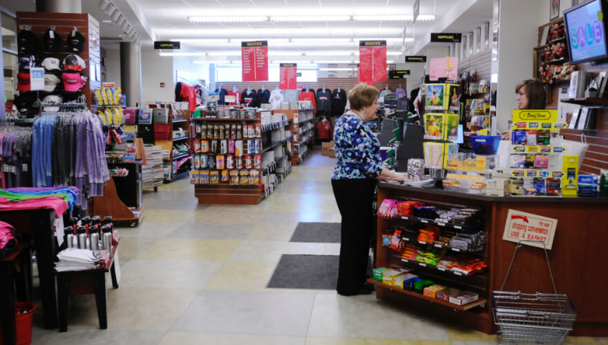 woman in the tyrus r. wessell bookstore purchasing items