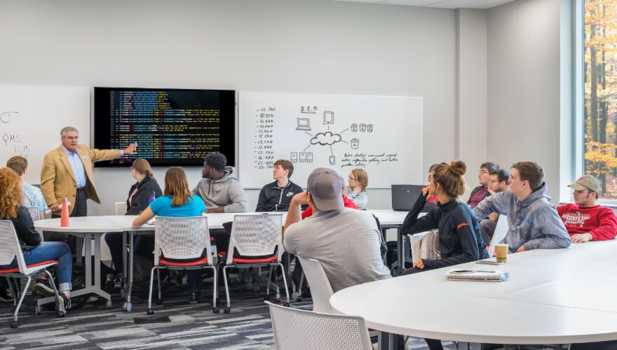 classroom with students and professor teaching