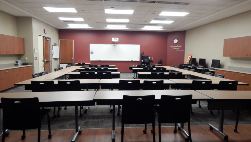 tables and chairs in occupational therapy skills lab