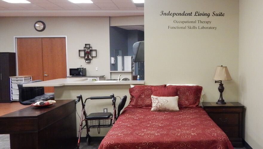 bedroom set and walker in occupational therapy skills lab