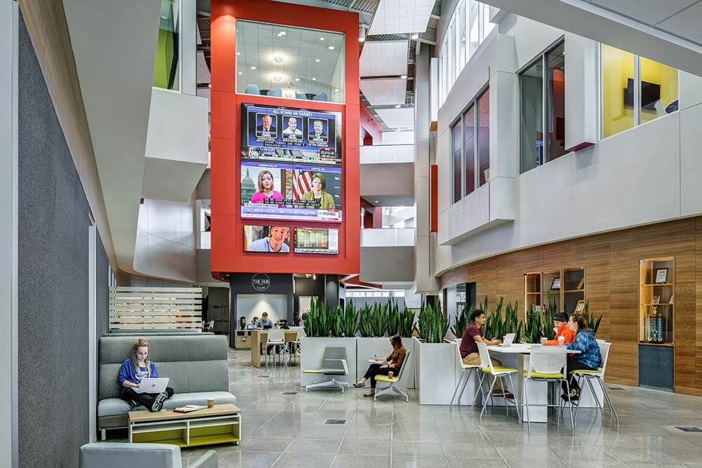 Interior of a building at Davenport. Large video screens are overhead.