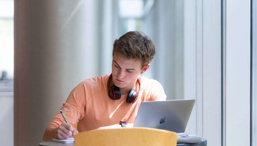 student studying in library