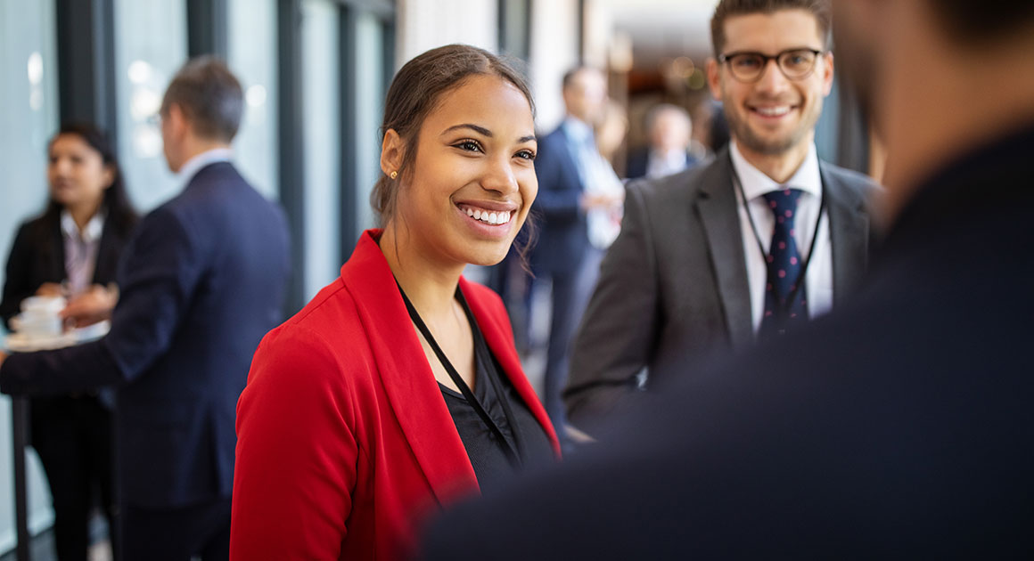 Young professional woman meeting professionals