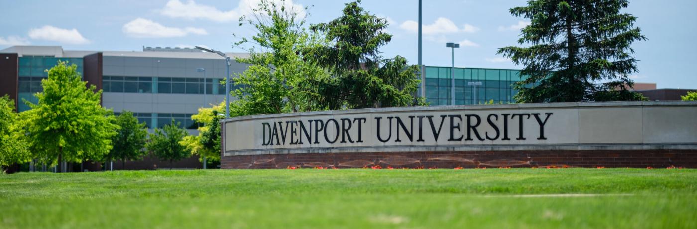 Campus entrance sign that says "Davenport Universtiy"