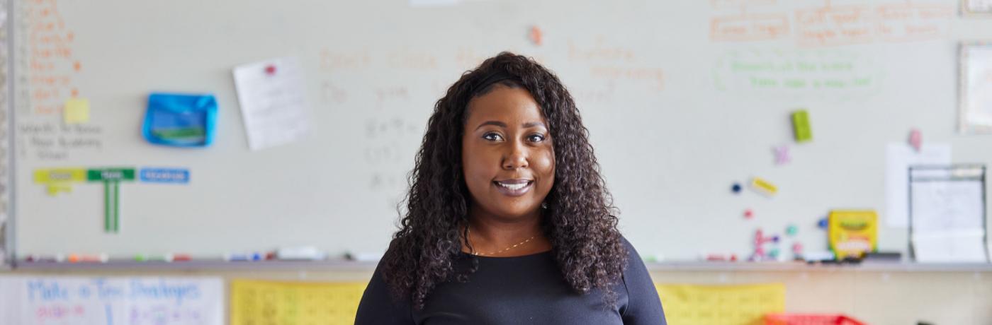 Teacher in front of whiteboard