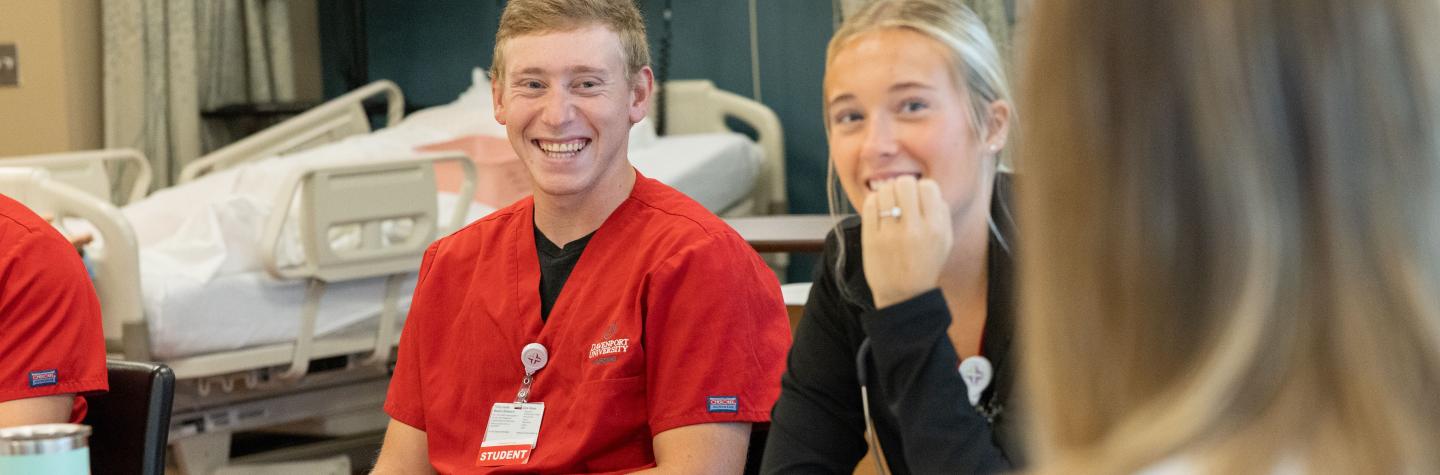 A male and a female nursing student in class