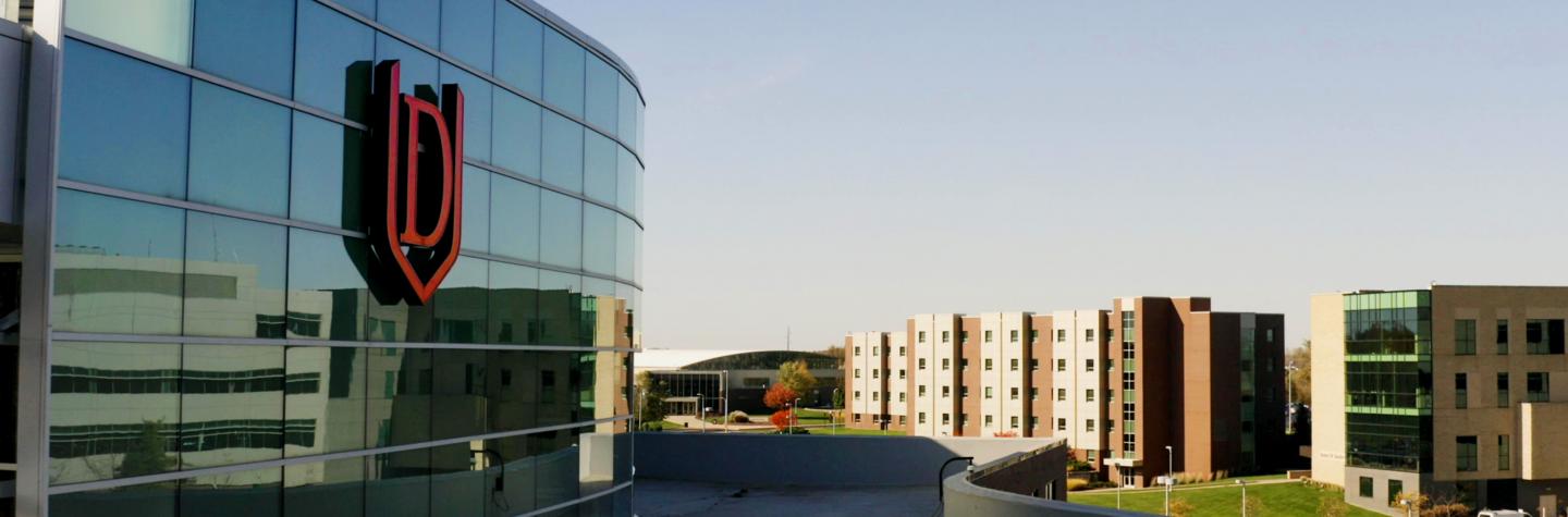 Drone photo of DU emblem on college of business building