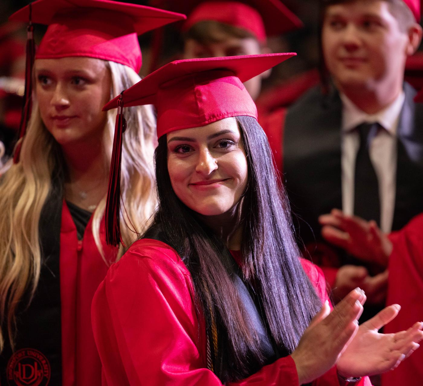 A group of students at Commencement in their cap and gowns