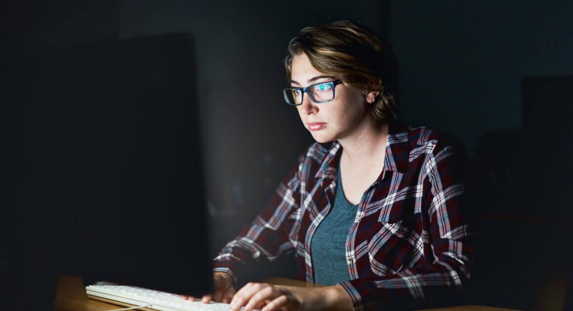 Woman typing on computer