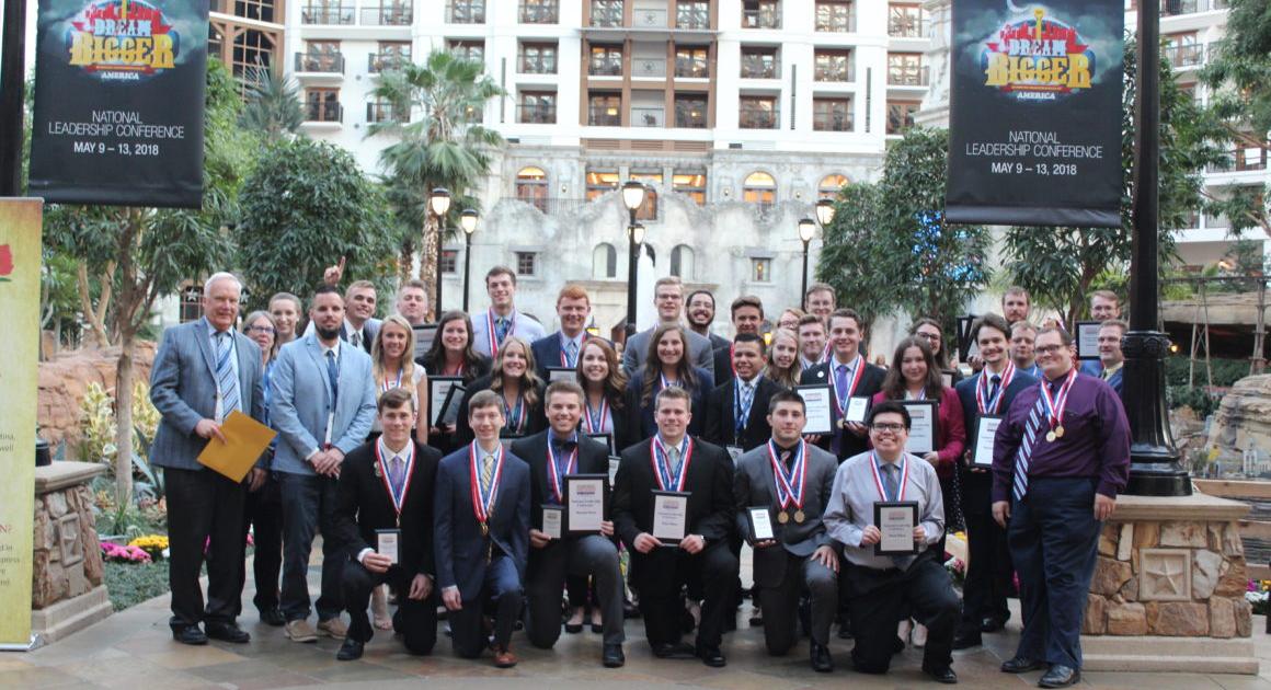 Group of Davenport students wearing medals at the conference