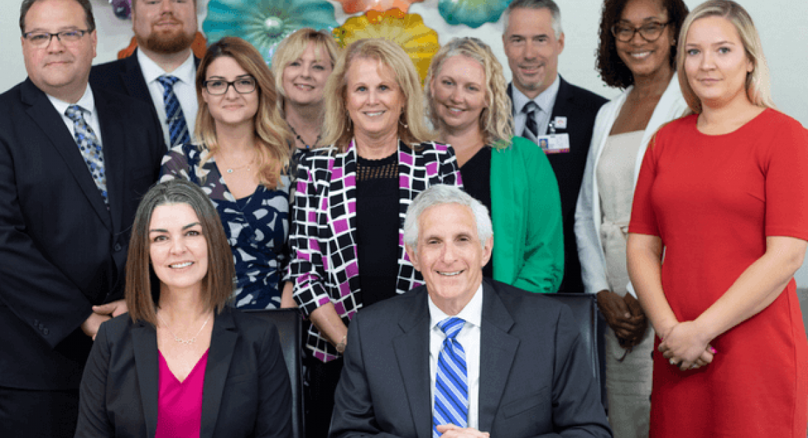 Group of smiling people in business attire