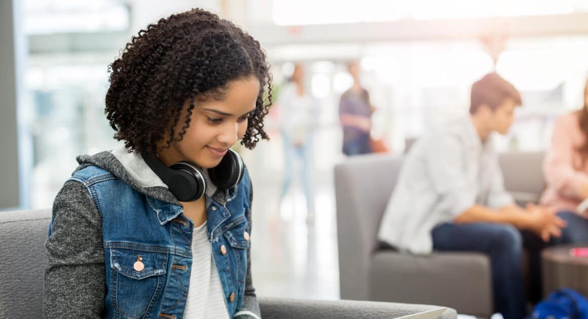 Student with headphones around her neck