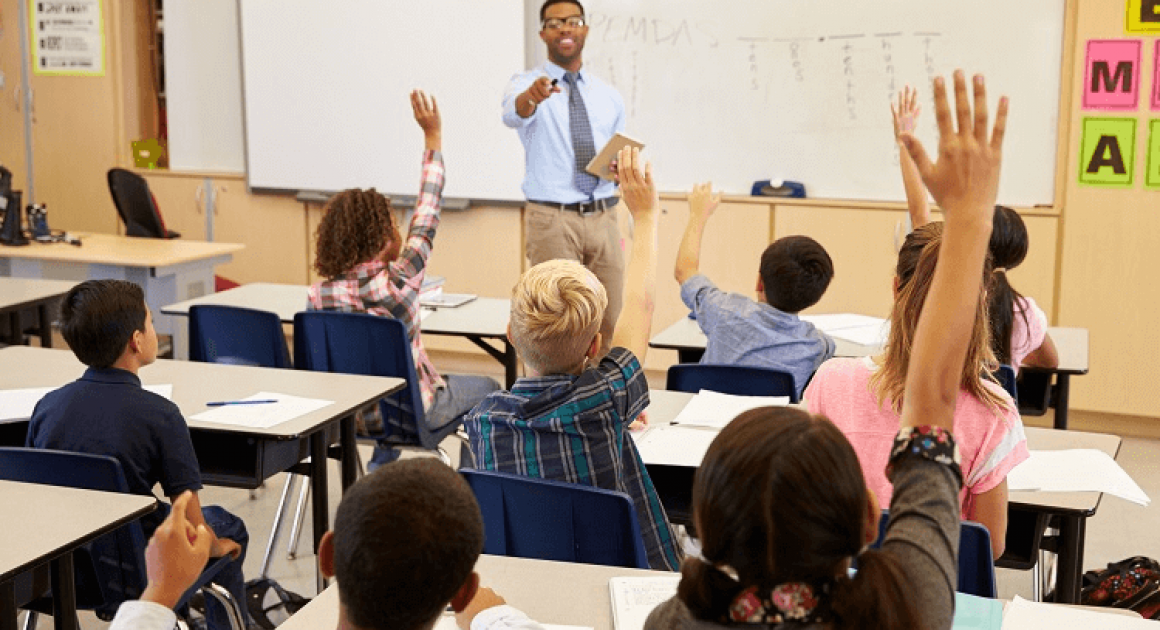 Students in a classroom, asking questions