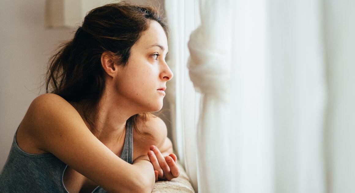 Female student looking out window