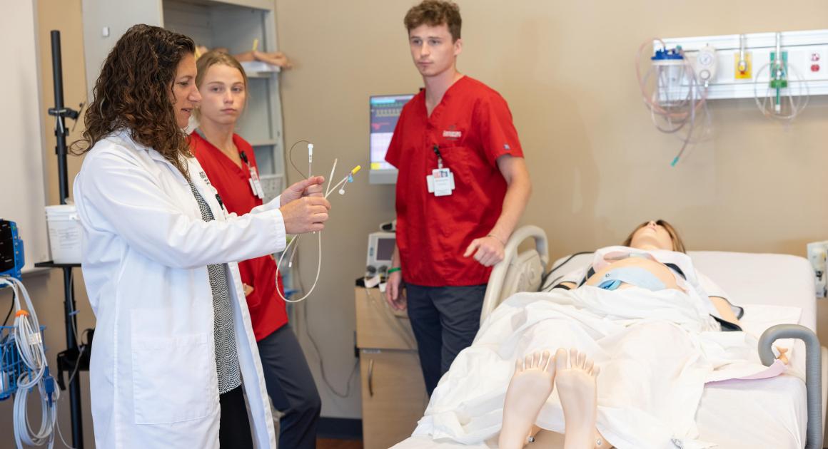 Two nursing students and a nursing professor 