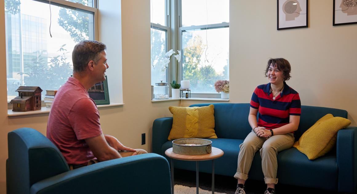 Inside the Wellness Center with a counselor and student